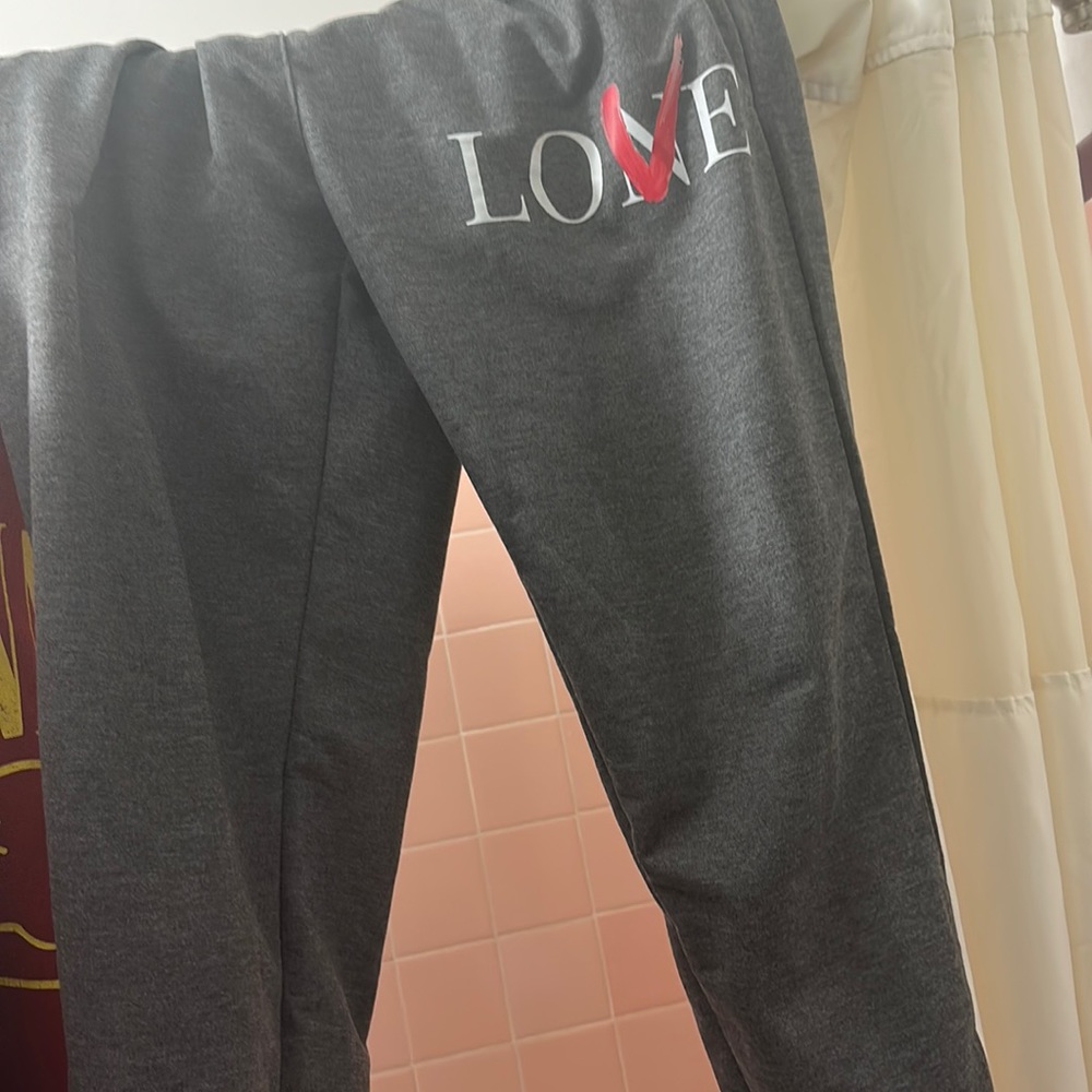 LOVE/LONE GREY SWEATPANTS NEVER HAVE BEEN WORN BEFORE. PERFECT CONDITION